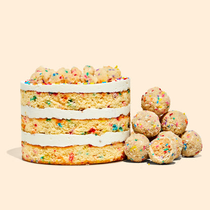 A 6" Birthday Cake next to a pile of b'day cake truffles.